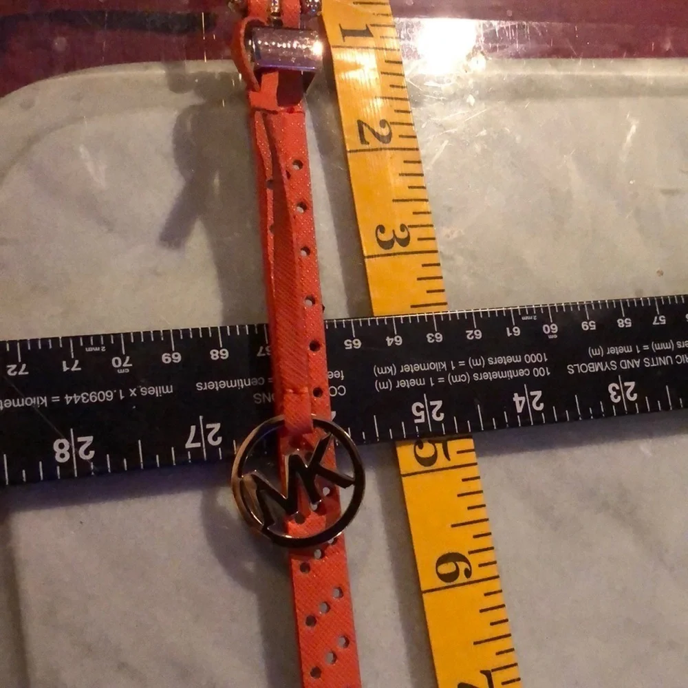 Micheal Kors M-LG Orange belt laser cut 1/4” wide gold hang tag tangerine